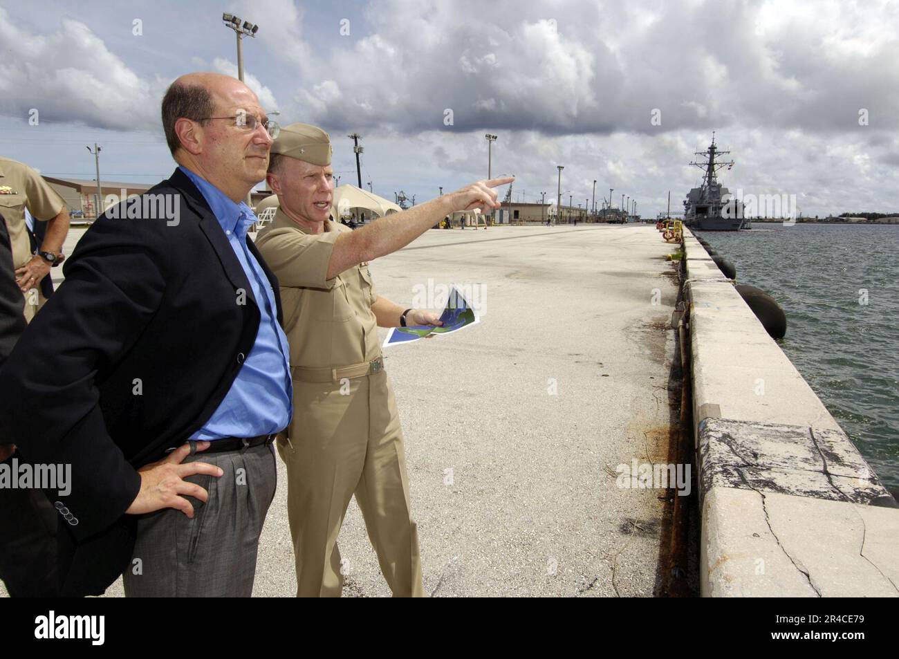 US Navy  Commander, U.S. Naval Forces Marianas, Navy Region Marianas Rear Adm. Charles Leidig, right, gives the Secretary of the Navy (SECNAV), the Honorable Dr. Donald C. Winter, a tour of Naval Base, Guam. Stock Photo