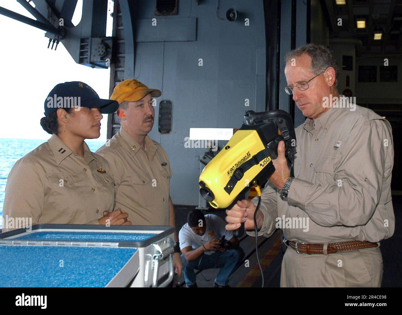 US Navy  In the hangar bay aboard the amphibious assault ship USS Kearsarge (LHD 3), Congressman Mike Conaway-(R), 11th Congressional District of Texas, inspects a K-90 Talisman thermal imaging system. Stock Photo