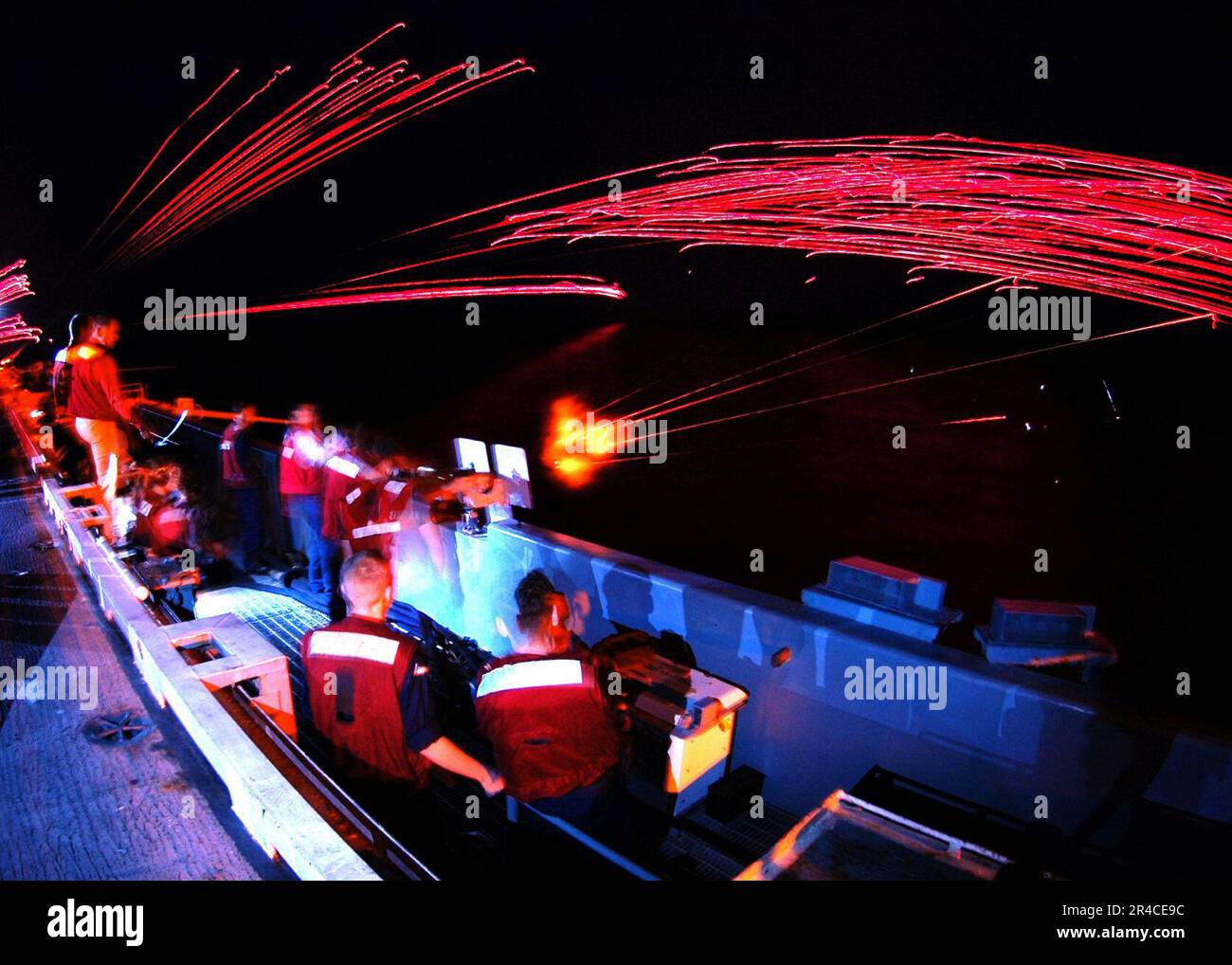 US Navy Sailors observe both M-240 machine gun and a .50 caliber ...