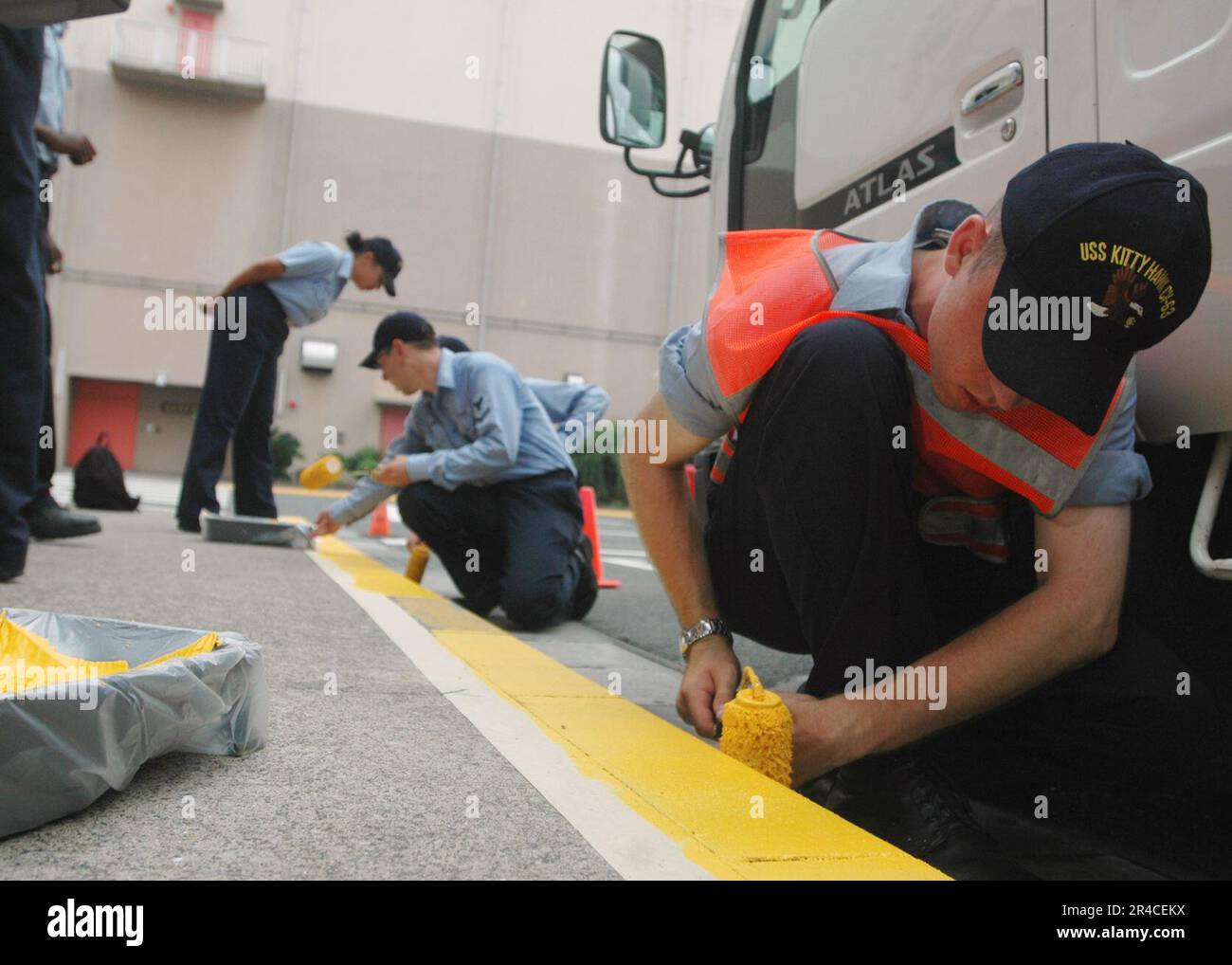 US Navy Aviation Ordnanceman Airman Apprentice and fellow Sailors