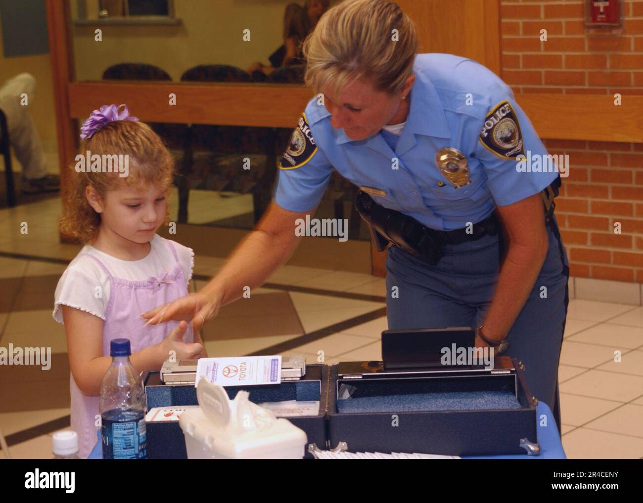 US Navy Officer with the Chesapeake Police Department takes children's