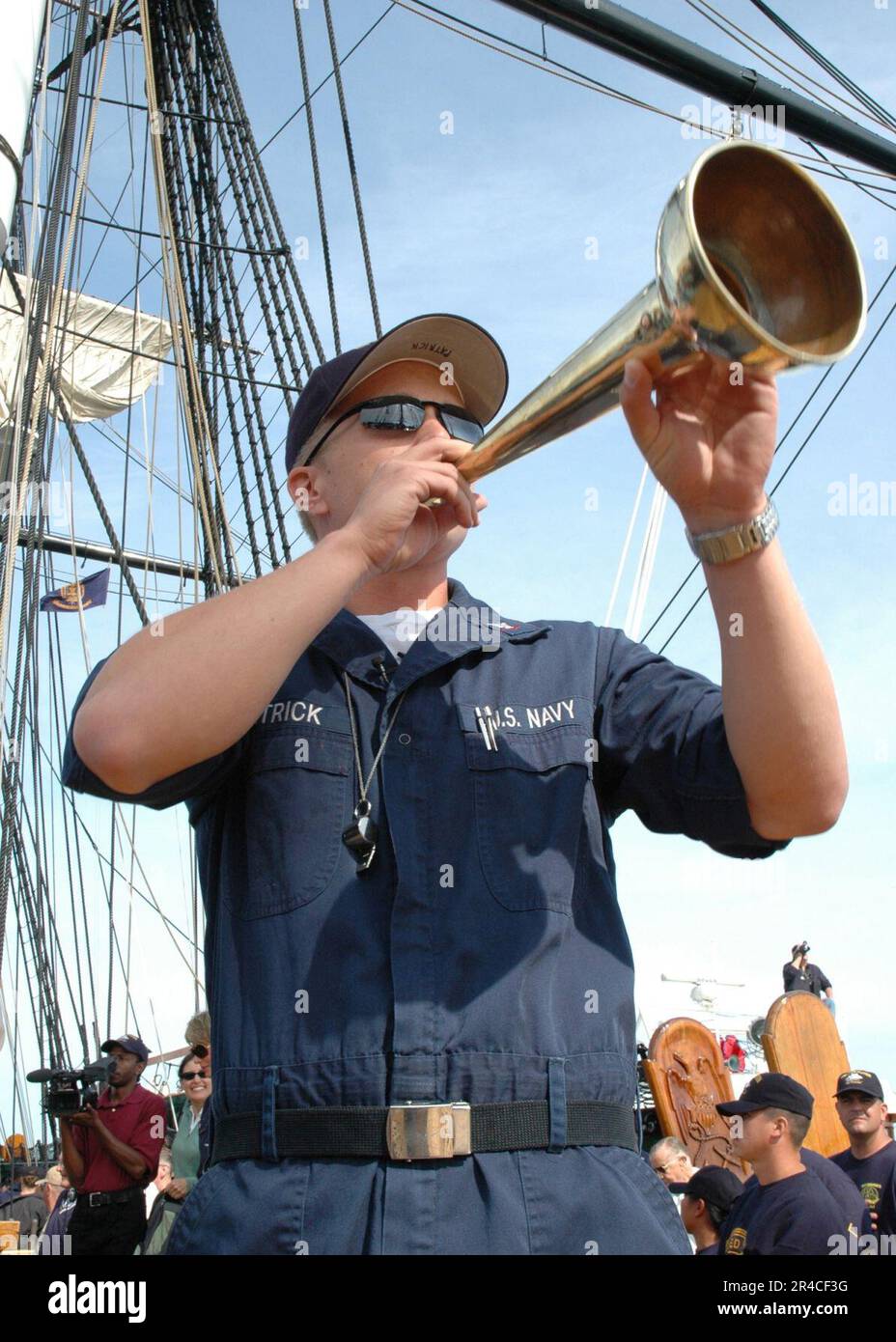US Navy Boatswain's Mate 3rd Class USS Constitution's Sailing Master, shouts sail commands Stock