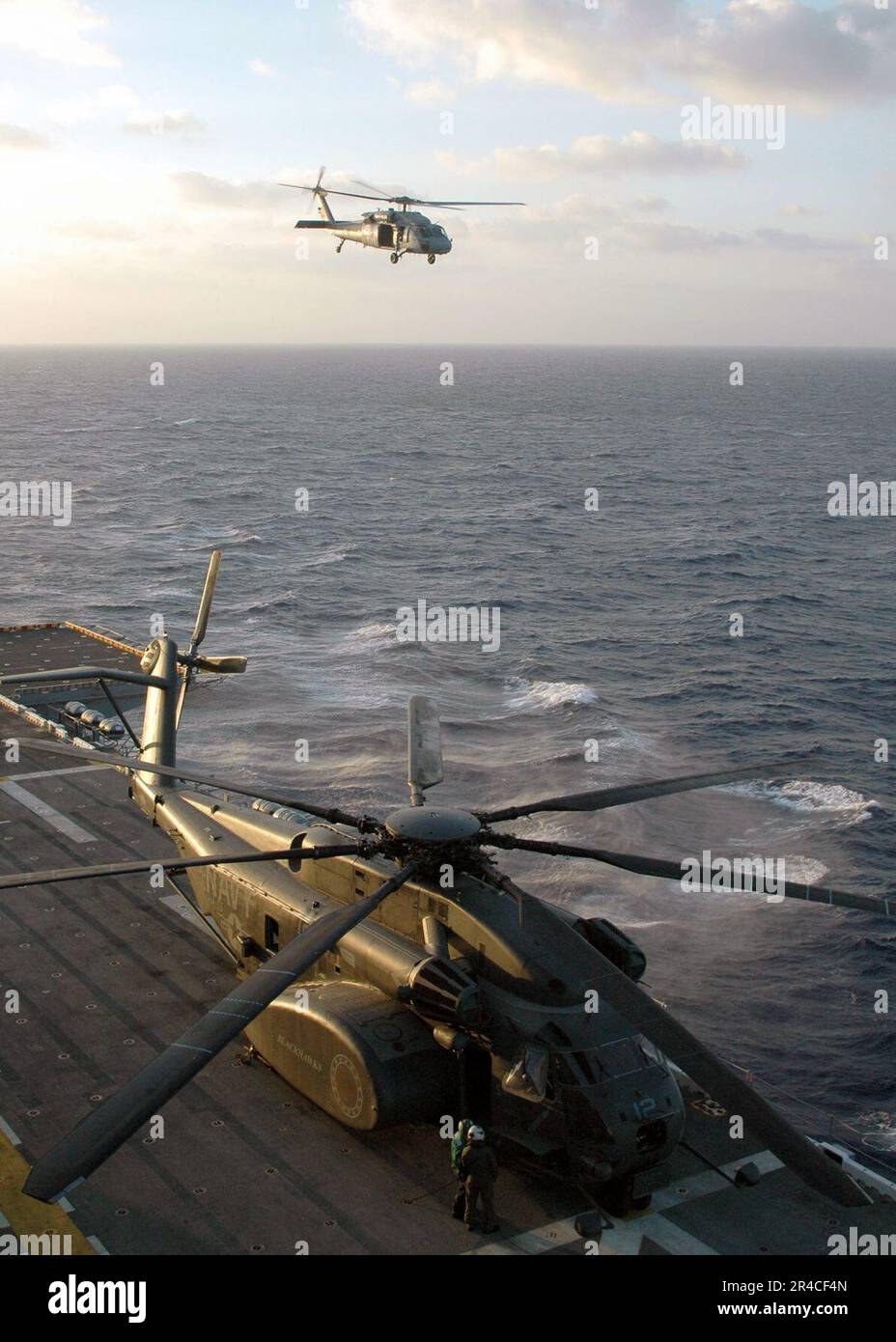 Us Navy A Mh 60s Seahawk Helicopter Performs Flight Operations Off The