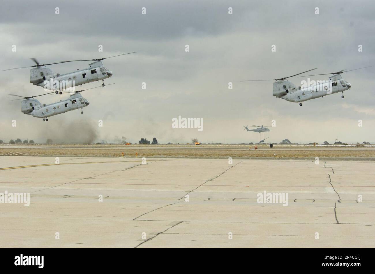 US Navy  Three U.S. Marine Corps CH-46E Sea Knight helicopters, assigned to Marine Medium Helicopter Squadron One Six Six (HMM-163) provides support during the Air show's Marine Air-ground Task Force (MA. Stock Photo