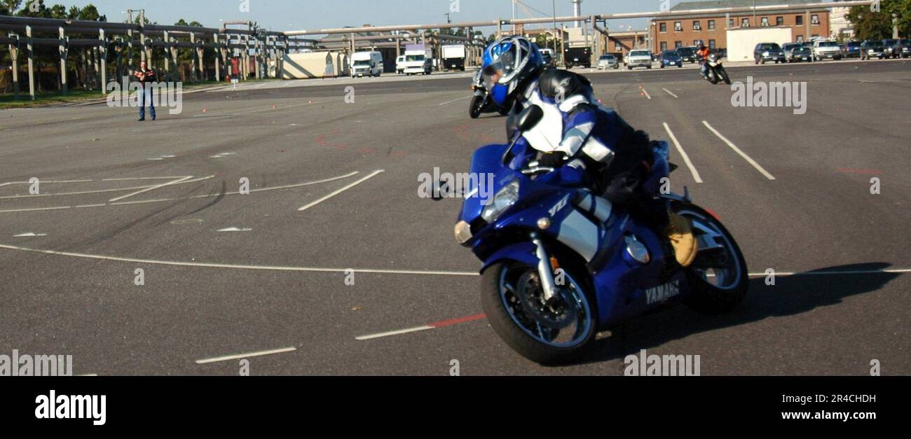 US Navy Active duty service members maneuver through the motorcycle