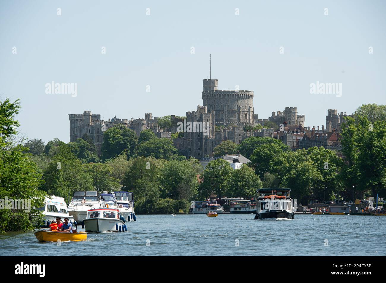 Windsor, Berkshire, UK. 27th May, 23. It was a beautiful warm and sunny day in Windsor Berkshire today as people flocked to the town for boat trips on the River Thames with the backdrop of the famous Windsor Castle. Credit: Maureen McLean/Alamy Live News Stock Photo