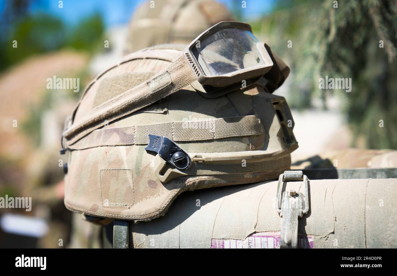 A kevlar helmet is seen with safety glasses during an exercise near Tapa, Estonia on 20 May, 2023. Estonia is hosting the Spring Storm NATO exercises involving over 13 thousand personnel with US, German, British, French and Polish forces training together with the Estonian Defence Forces (eDF). (Photo by Jaap Arriens / Sipa USA) Stock Photo