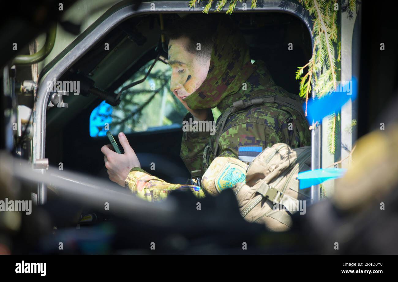 An Estonian soldier is seen applying camouflage makeup in Tapa, Estonia on 20 May, 2023. Estonia is hosting the Spring Storm NATO exercises involving over 13 thousand personnel with US, German, British, French and Polish forces training together with the Estonian Defence Forces (eDF). (Photo by Jaap Arriens / Sipa USA) Stock Photo