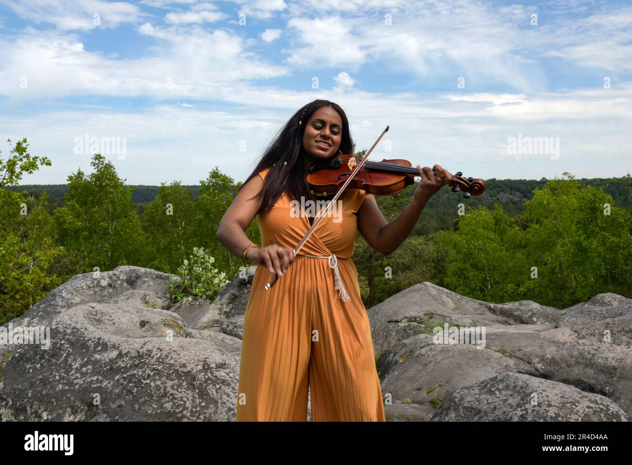 Lovely black woman playing violin in the forest in France Stock Photo ...
