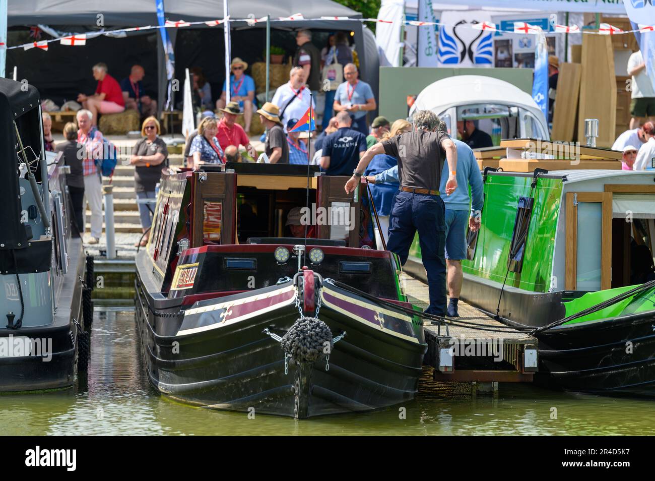 Bright sunshine greeted the crowds visiting the Crick Boat Show taking place over the bank holiday weekend close to the Grand Union Canal in Northamptonshire. Stock Photo