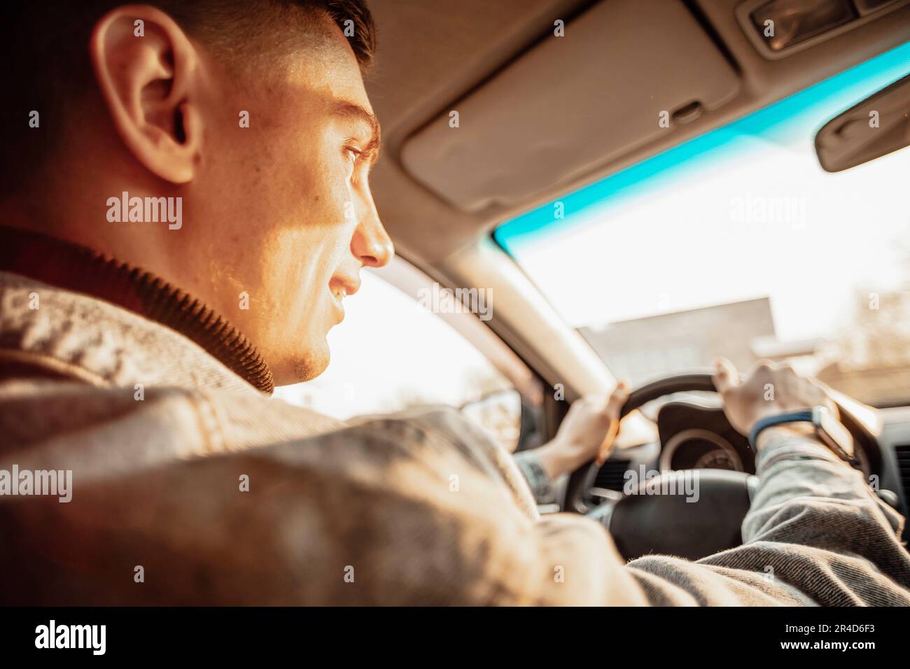 Hand man sitting behind wheel hi-res stock photography and images - Alamy