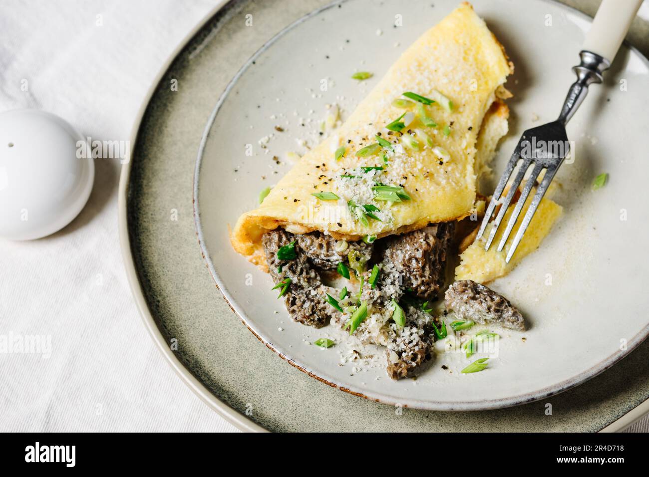 Omelette with morel mushrooms in a creamy garlic sauce Stock Photo Alamy