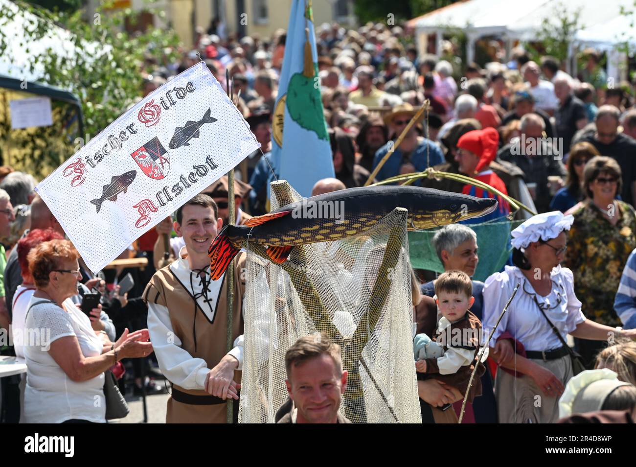 Allstedt, Germany. 27th May, 2023. The fishermen's guild of Allstedt parades through the town. The 500th anniversary of Thomas Müntzer's arrival in Allstedt is celebrated. The radical reformer was pastor in the town church of St. Johannis for a few months. Credit: Heiko Rebsch/dpa/ZB/dpa/Alamy Live News Stock Photo