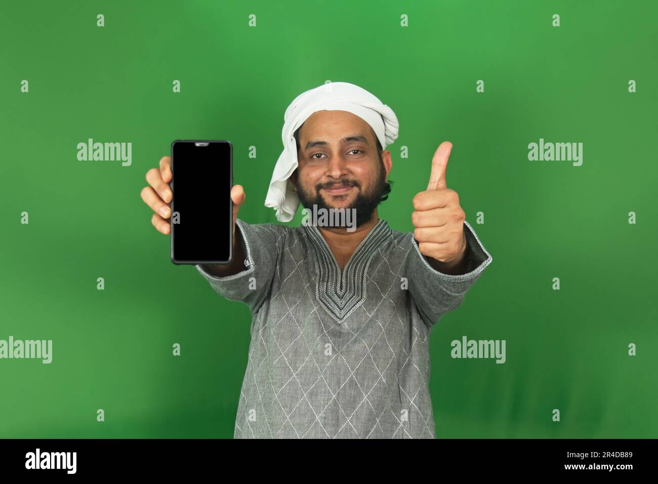 Young Indian Farmer Showing His Mobile And Left Hands Thumbs Up In ...