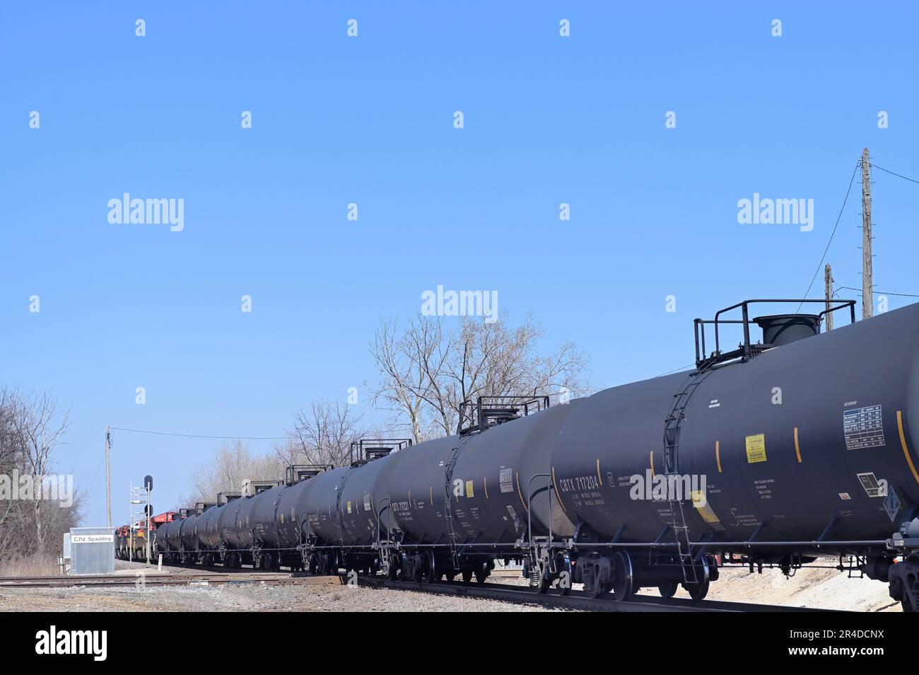Elgin, Illinois, USA. A long string of tank cars in a freight train passing through northeastern Illinois. Stock Photo