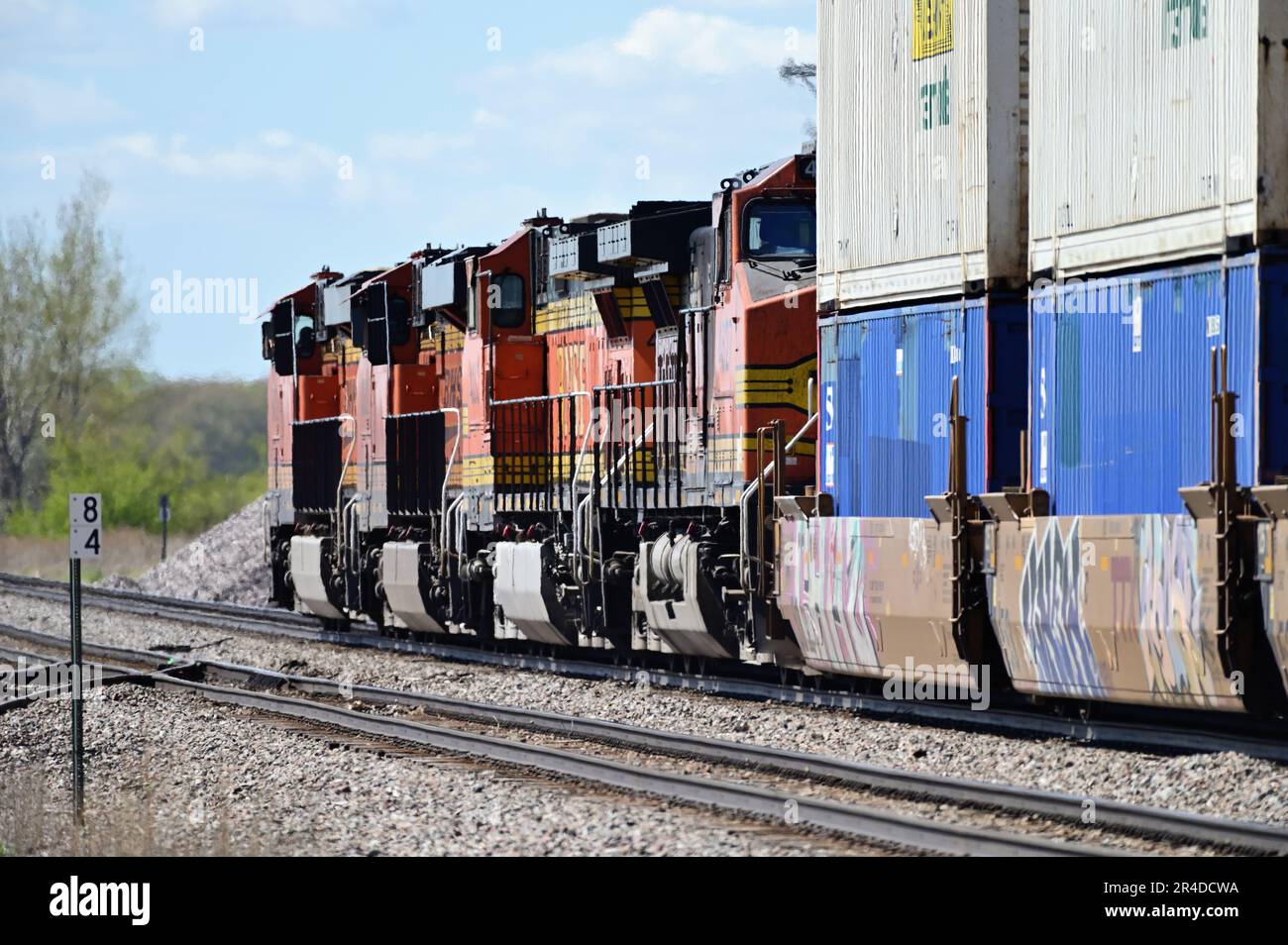 Rochelle, Illinois, USA. A Burlington Northern Santa Fe Railway intermodal freight train westbound through north central Illinois. Stock Photo