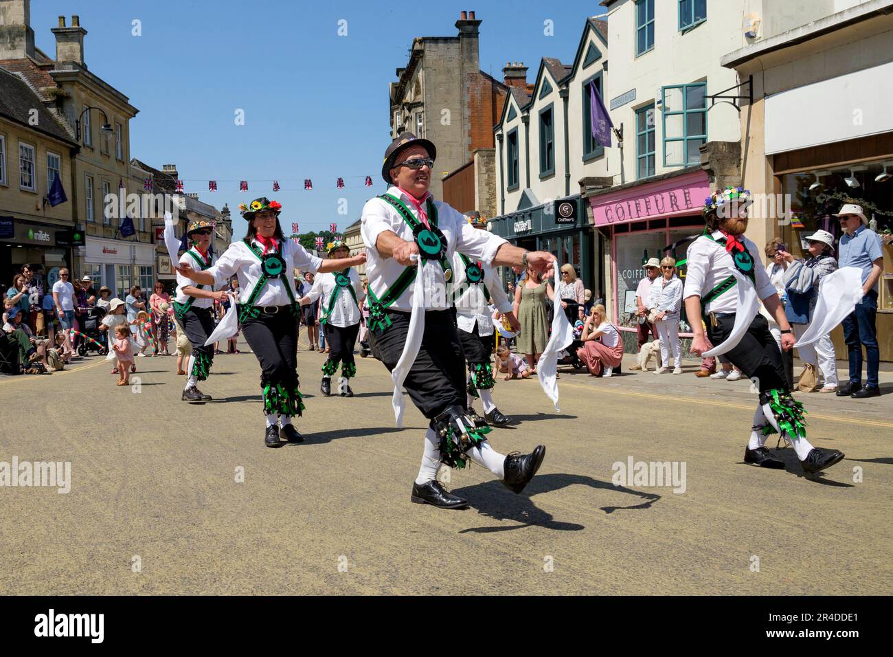Chippenham, UK, 27th May, 2023. Morris dancers from Sweyn's Ey Morris from Swansea in Wales are pictured entertaining the crowd during the opening day of the 2023 Chippenham folk festival. The 2023 festival is the festivals 50th Anniversary. Credit: Lynchpics/Alamy Live News Stock Photo