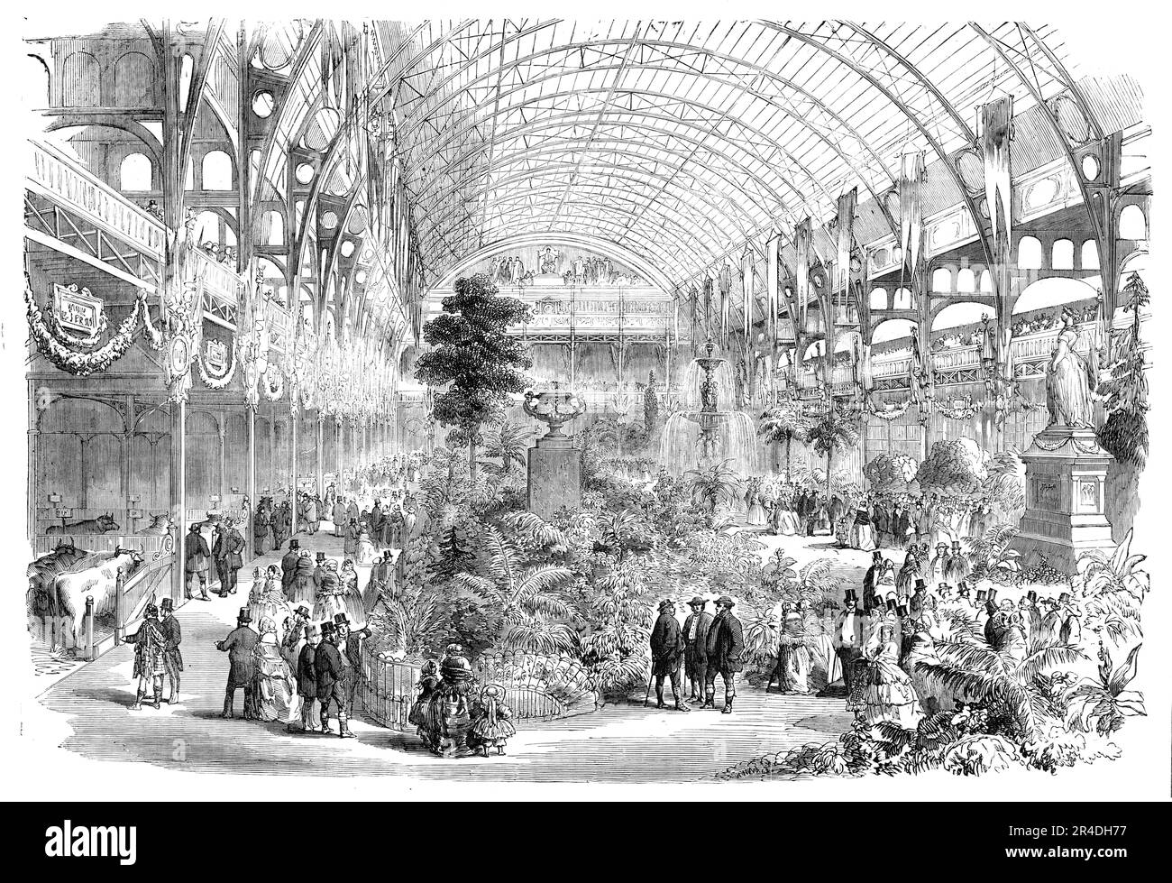 The Universal Cattle Show and Agricultural Exhibition, Paris, 1856. Visitors at the Palais de l'lndustrie. '...the ground in the centre of the building...has been transferred into a delicious garden...Grassplats with their velvet verdure, graceful flower-beds, shrubs, fountains, groups of statuary - all, in fine, that could refresh the sight, and shed a charm over the whole place, has been got together. Standing, from the gallery, one may fancy he was looking over some fair valley, rich in verdure and fragrant in flowers, while the singing of birds from aviaries half concealed amid the trees a Stock Photo