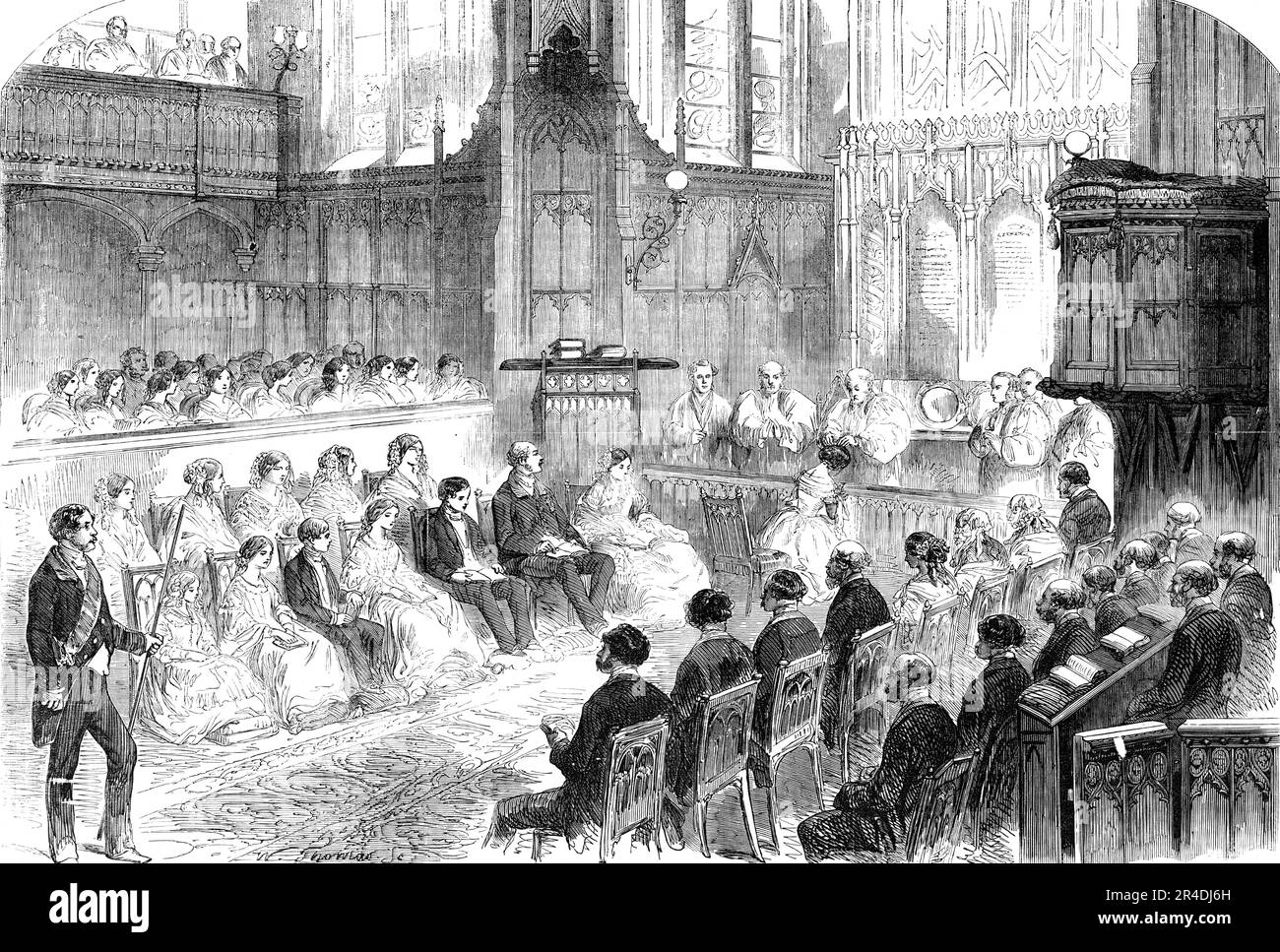 Confirmation of Her Royal Highness the Princess Royal, in the Private Chapel, Windsor Castle, 1856. Victoria, Princess Royal is confirmed by the Archbishop of Canterbury, John Bird Sumner. (Confirmation is seen as the sealing of the covenant created in baptism). Also present were her parents Queen Victoria and Prince Albert, and her godfather King Leopold I of Belgium. 'The Princess Royal wore a rich white silk glac&#xe9; gown, with five flounces pinked, the body richly trimmed with white ribbon and Mechlin lace...The ceremony commenced by a hymn, sung by the gentlemen and boys of the Royal Ch Stock Photo