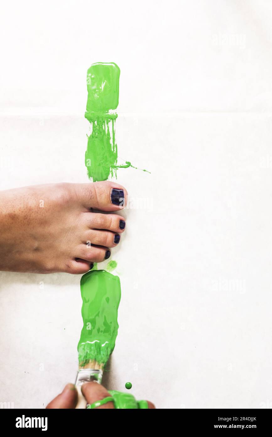 Painting with acrylic enamel without staining human limbs Stock Photo
