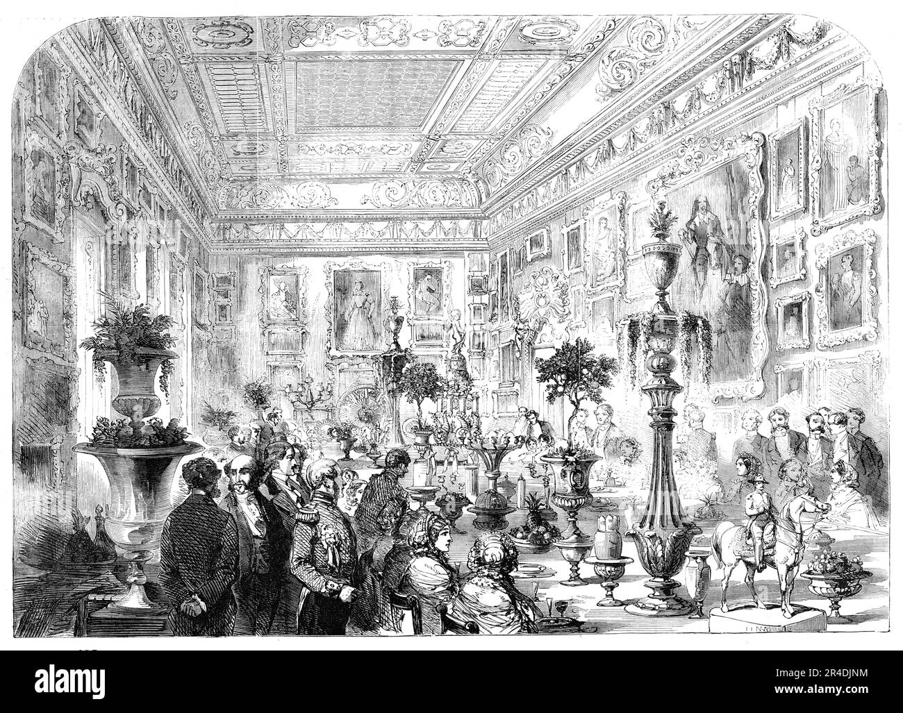 Marriage of Sir Robert Peel and Lady Emily Hay - The Dejeuner in the Waterloo Gallery at Apsley House, [London], 1856. 'The table, which was a miracle of ornamental decoration, extended from end to end of the gallery; and at each extremity rose...ornamented with garlands of flowers, the two gigantic candelabra of Russian porphyry...In the middle of the table was the celebrated Portuguese plateau, extending, in solid silver, five-and-twenty feet. From the centre...rose the elegant Wedding Cake...Orange-trees, bearing ripe fruit and blossoms, shed their odours upon the table...The famous Dresden Stock Photo