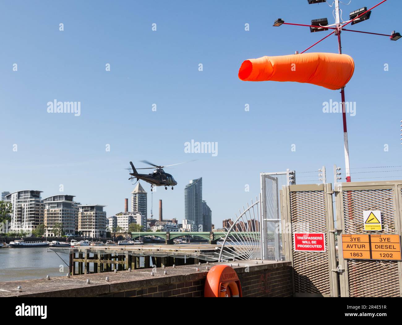 A helicopter landing at London Heliport, Lombard Road, Battersea