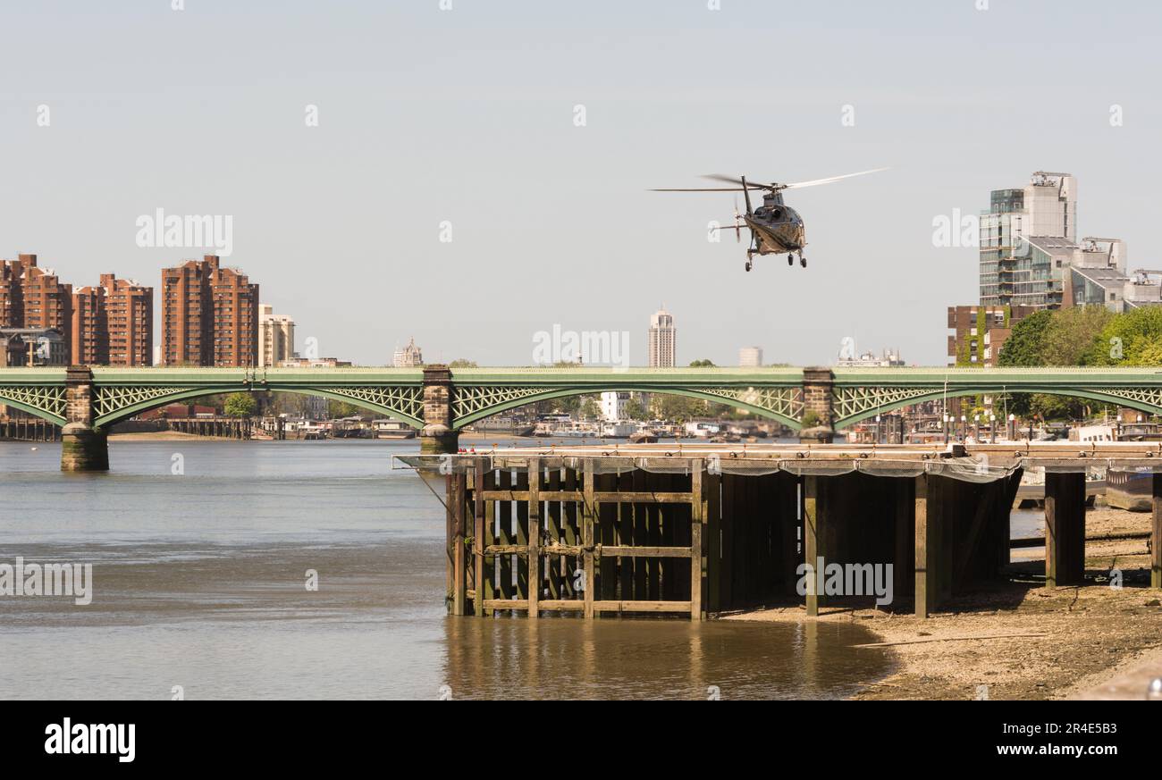 A helicopter taking off from London Heliport, Lombard Road, Battersea