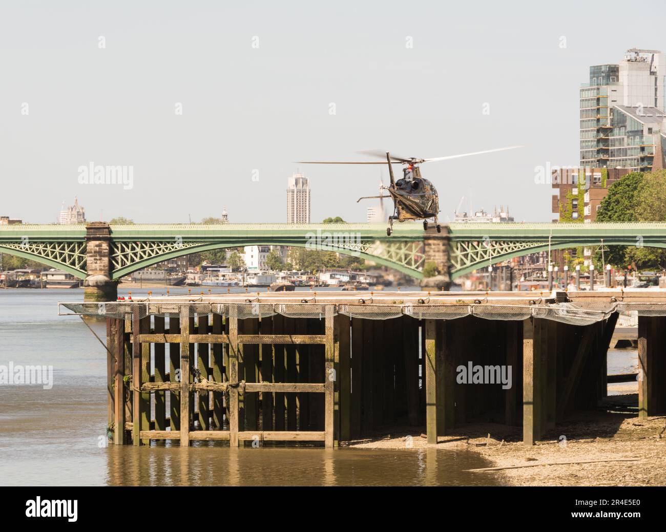 A helicopter taking off from London Heliport, Lombard Road, Battersea