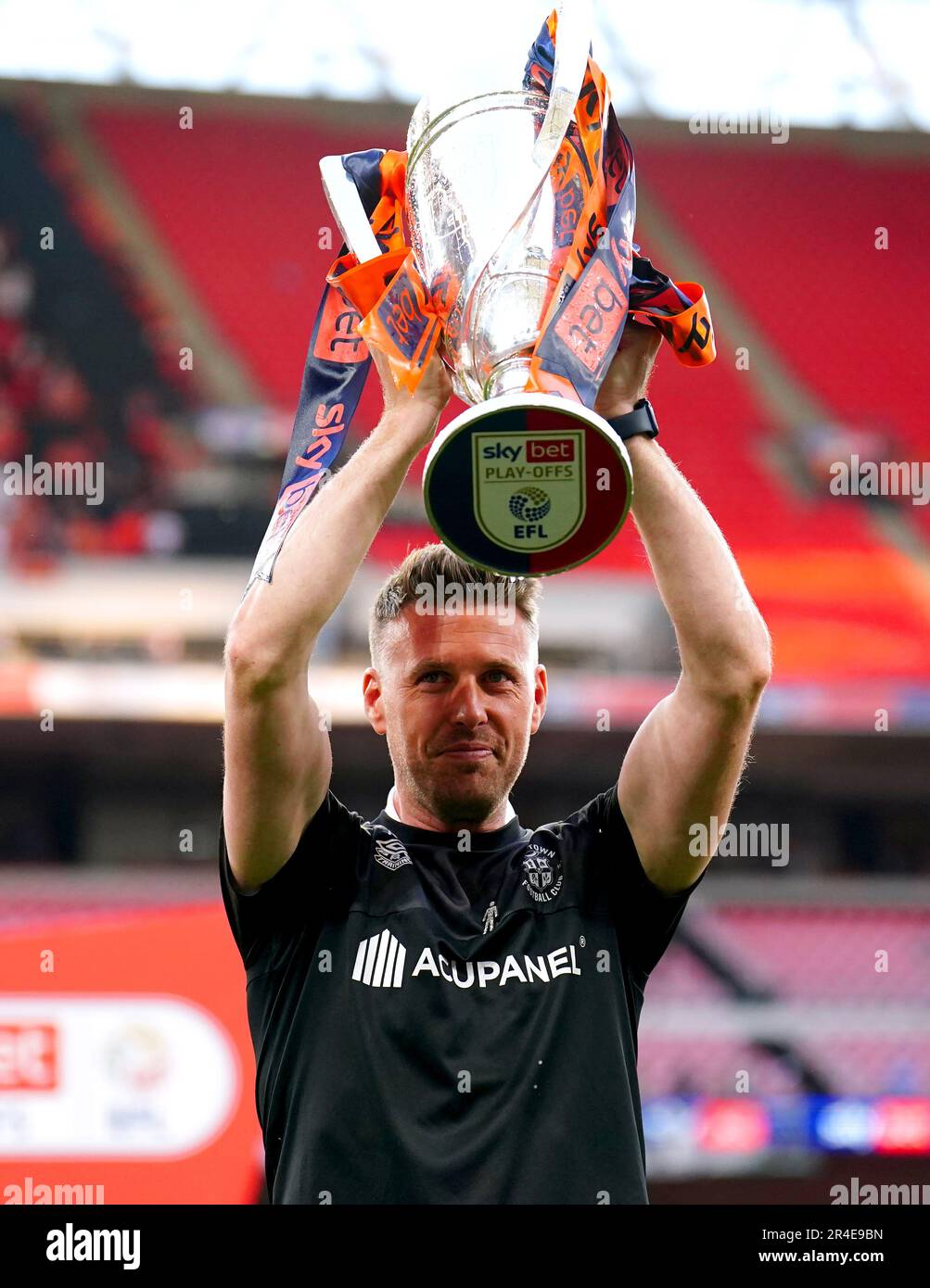 Luton Town manager Rob Edwards celebrates with the trophy after winning the Sky Bet Championship play-off final at Wembley Stadium, London. Picture date: Saturday May 27, 2023. Stock Photo