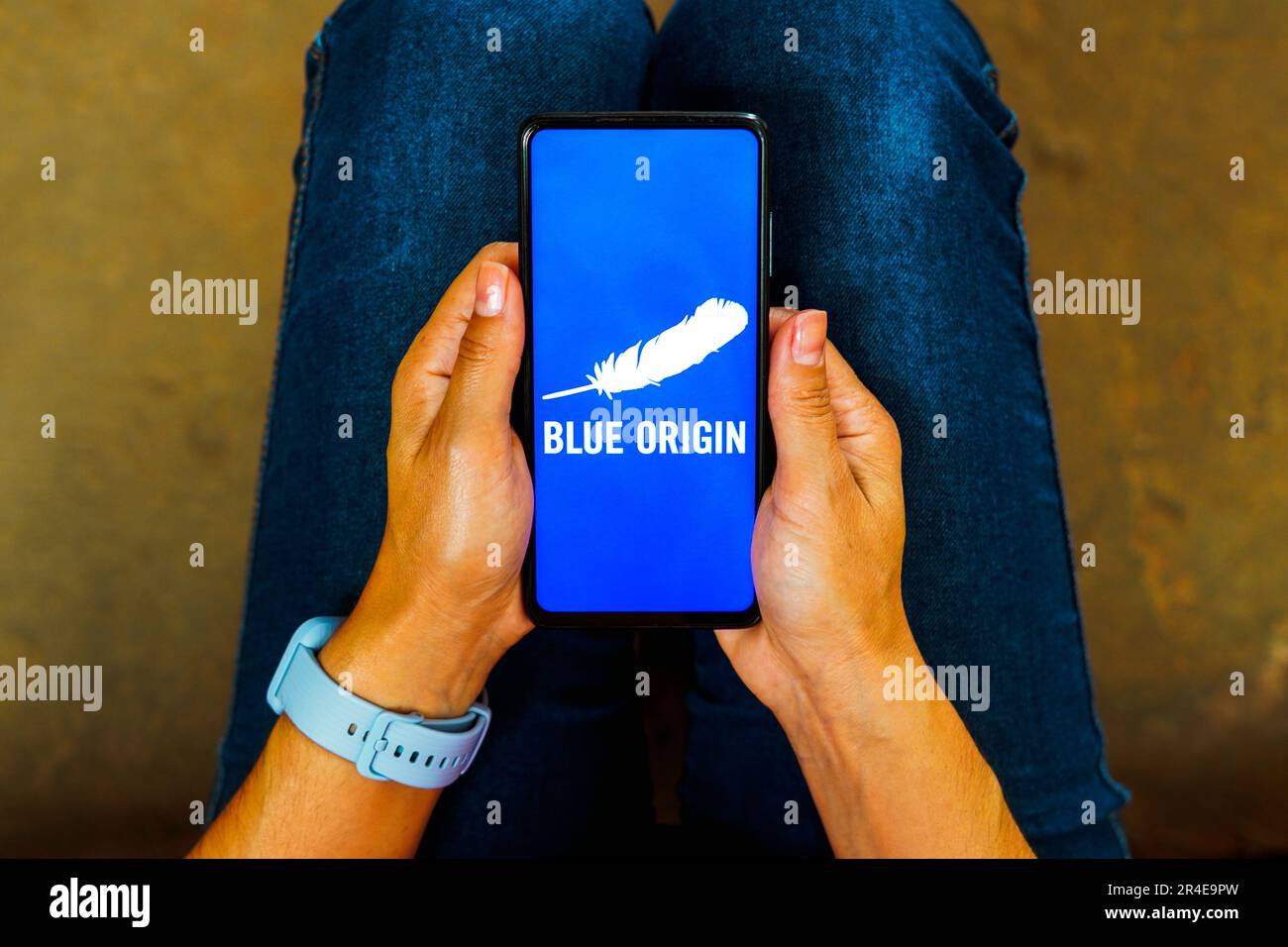 In this photo illustration, the Blue Origin logo is displayed on a