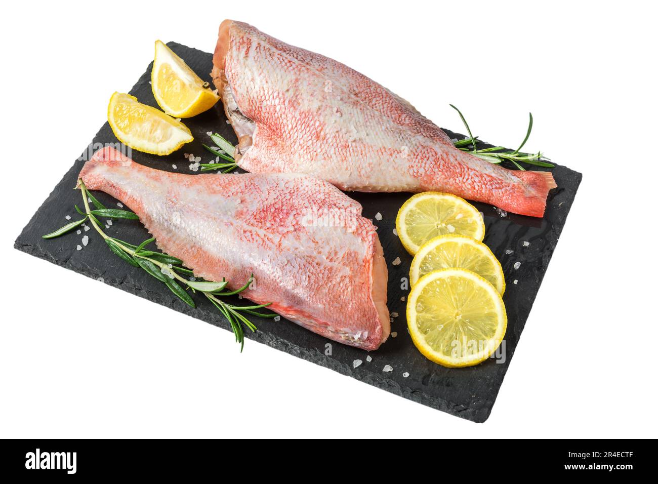 Fresh fish sebastes and ingredients for cooking. Raw gutted fish with ...