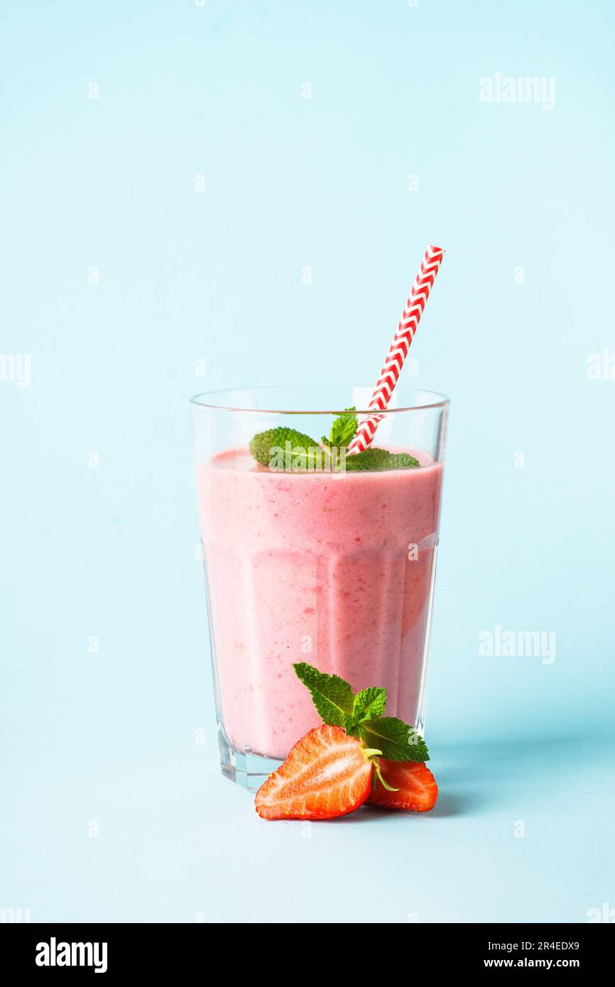 Strawberry smoothie or milkshake on white Stock Photo Alamy