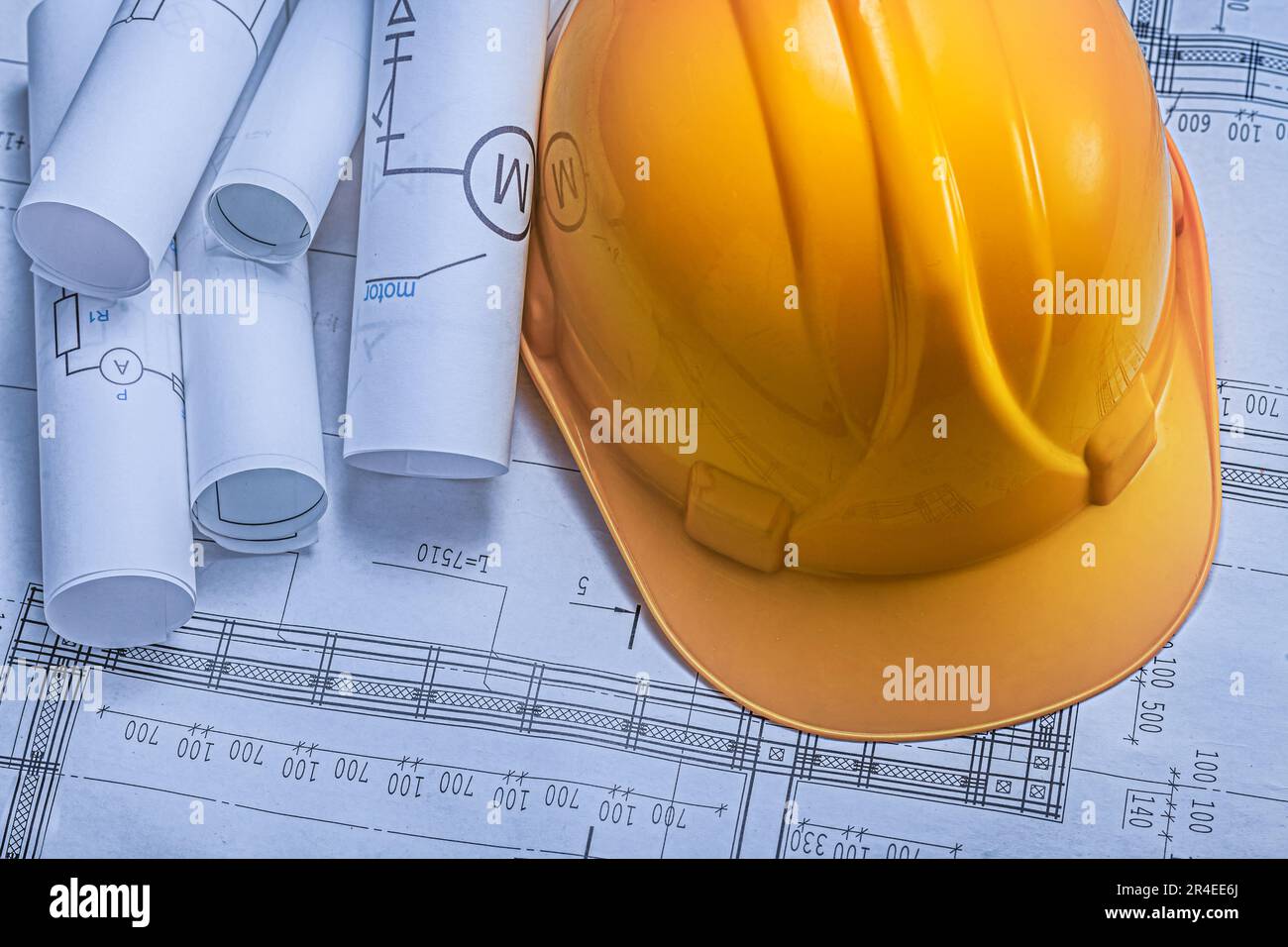 An Yellow Construction Helmet On Background Of Blueprints Stock Photo ...