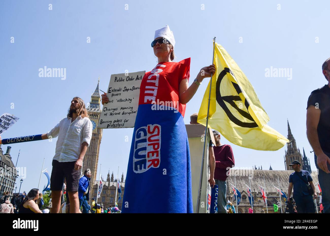 London, UK. 27th May, 2023. A protester wearing a superglue costume