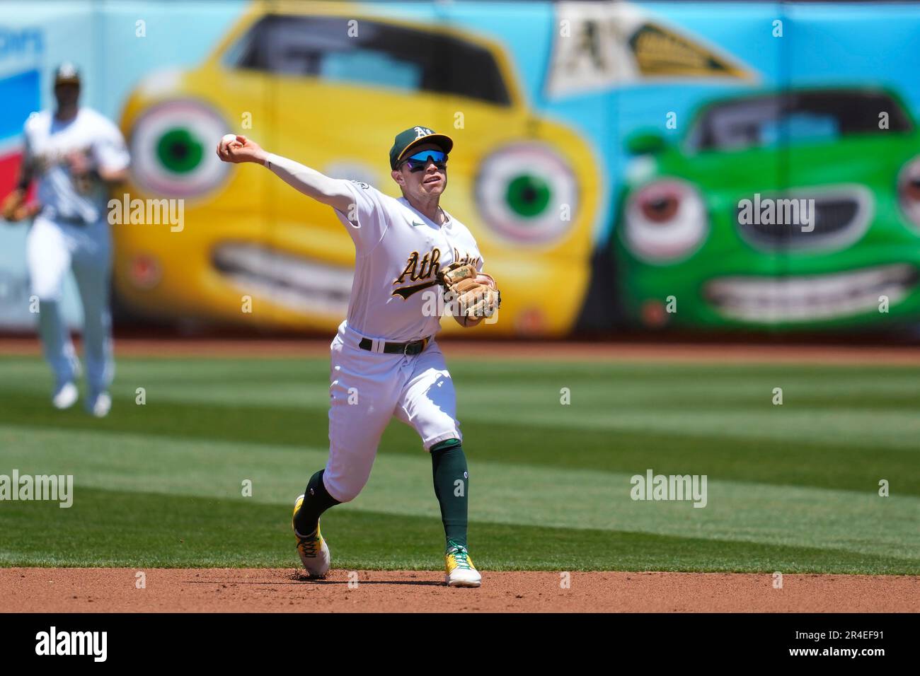 Oakland Athletics shortstop Nick Allen makes a throwing error on a