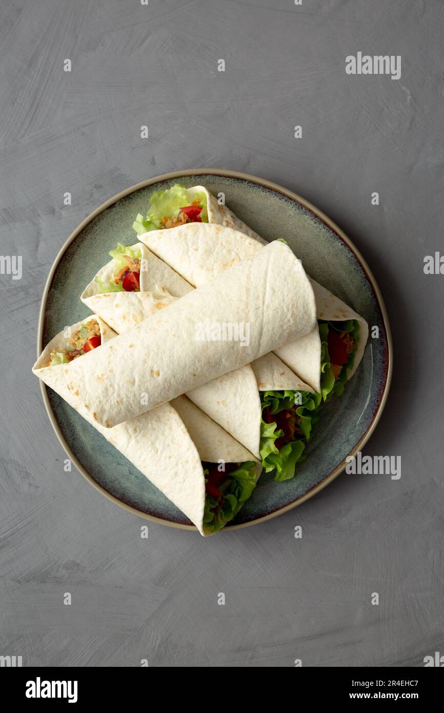 Homemade Avocado Tuna Wraps on a Plate, top view. Flat lay, overhead ...