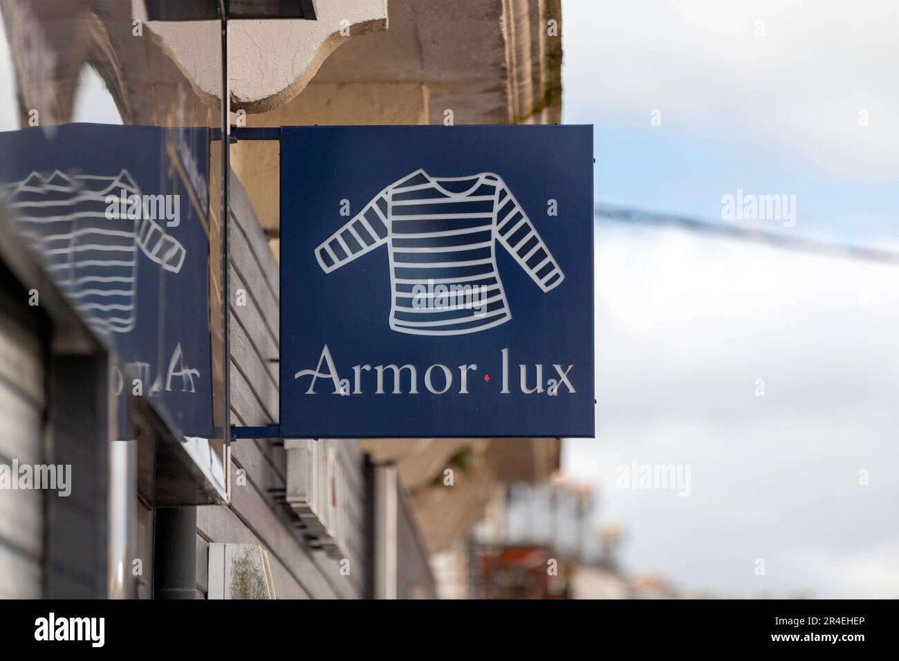 Carhaix, France - May 01 2023: Sign of Armor-Lux, a French company specializing in the design, manufacture and distribution of clothing, in particular Stock Photo
