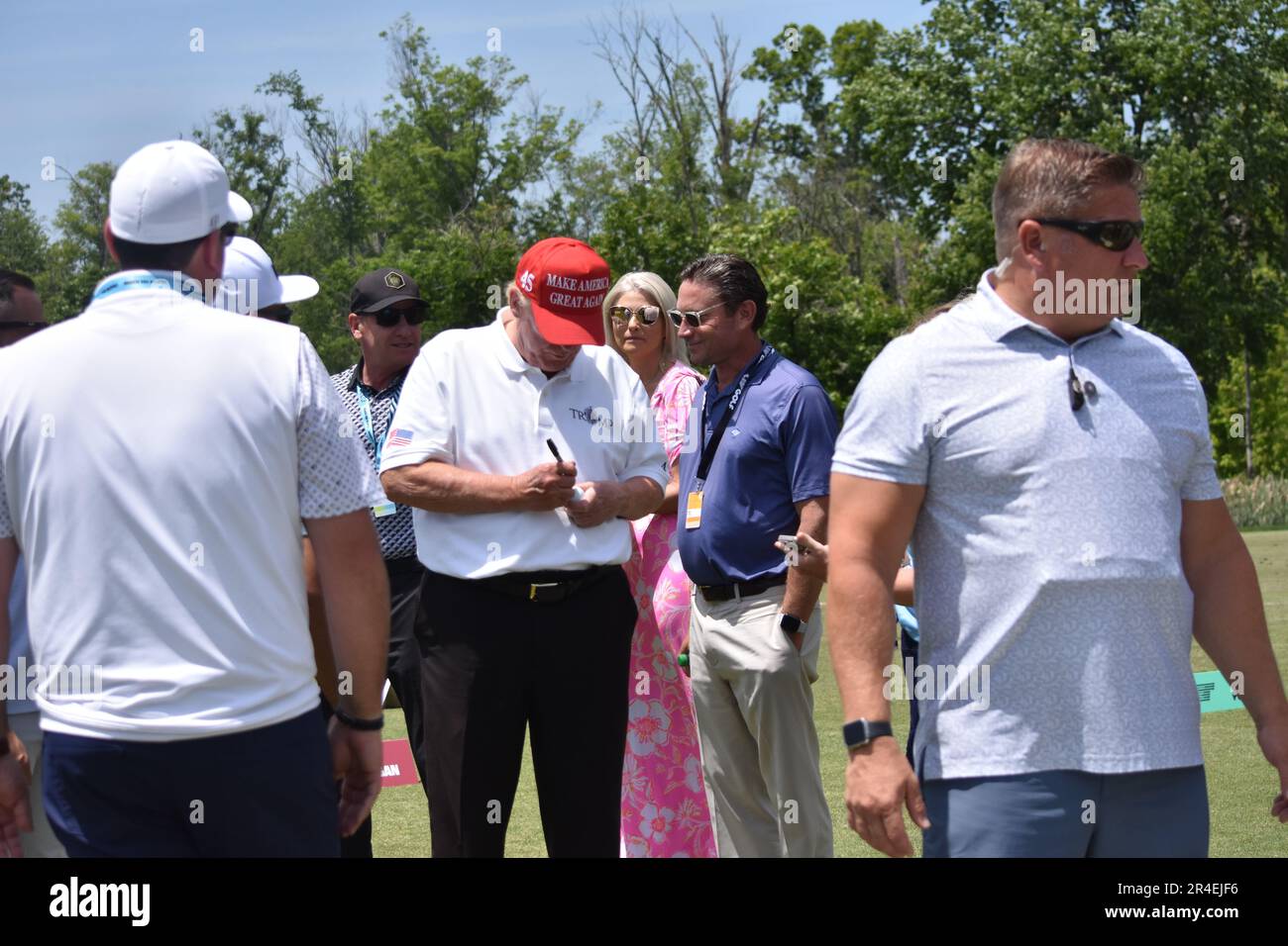 Sterling, United States. 27th May, 2023. Former President of the United States Donald J. Trump takes photos, signs objects as he visits the driving range. Former President of the United States Donald J. Trump visits the driving range, meets fans and watches LIV Golf Washington DC 2023 Round 2 at Trump National Golf Club Washington DC in Sterling, Virginia, United States. Credit: SOPA Images Limited/Alamy Live News Stock Photo