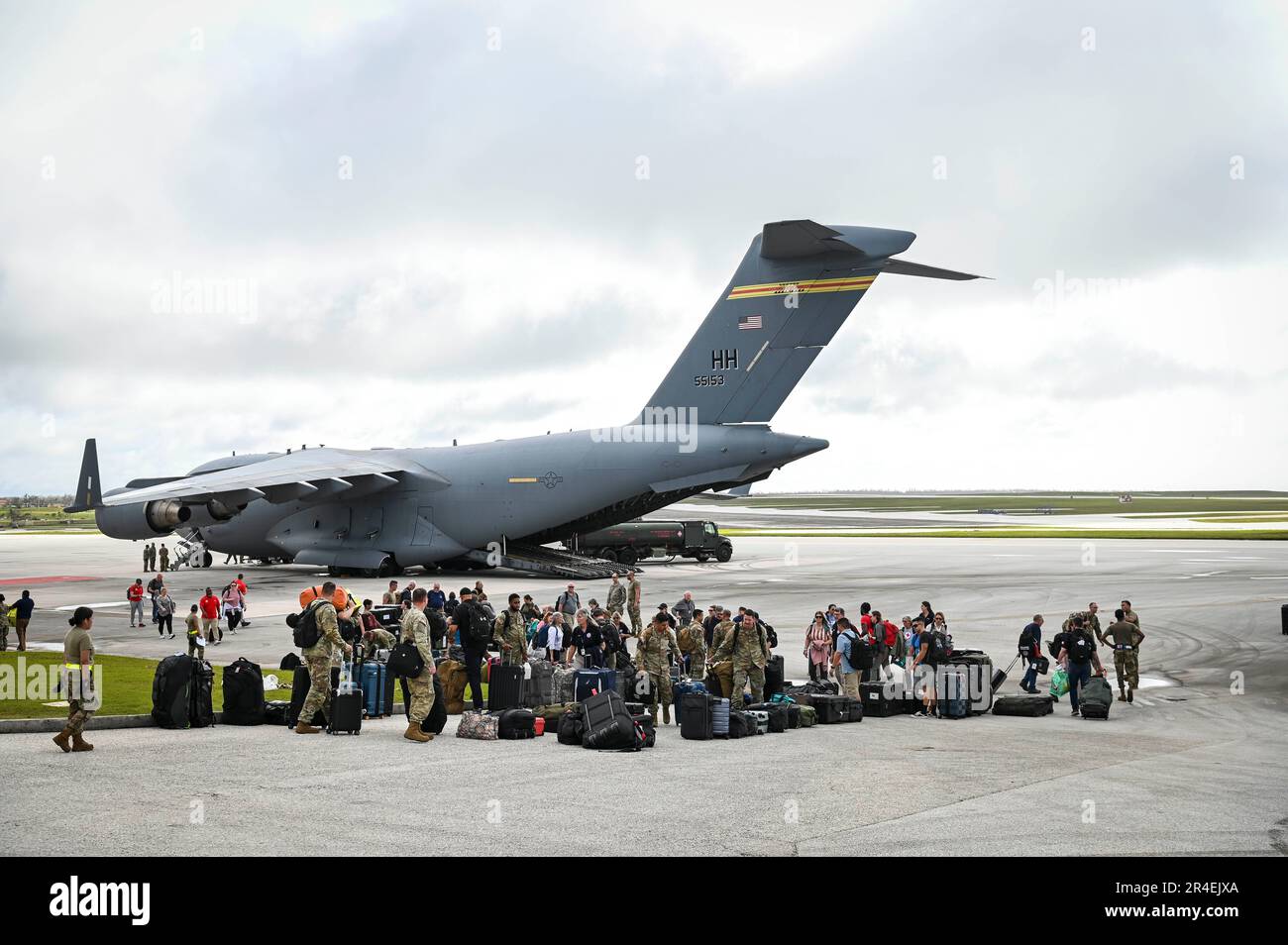 Airmen assigned to the 734th Air Mobility Squadron assist with cargo of Federal Emergency Management Agency personnel on Andersen Air Force Base, Guam, 26 May, 2023.  FEMA personnel arrived to Guam to assist with Typhoon Mawar relief efforts. Typhoon Mawar was a Category 4 storm, producing winds of at least 130 mph (209 km) making it one of the stronger typhoons to hit Guam in decades. (U.S. Air Force photo by Staff Sgt. Divine Cox) Stock Photo