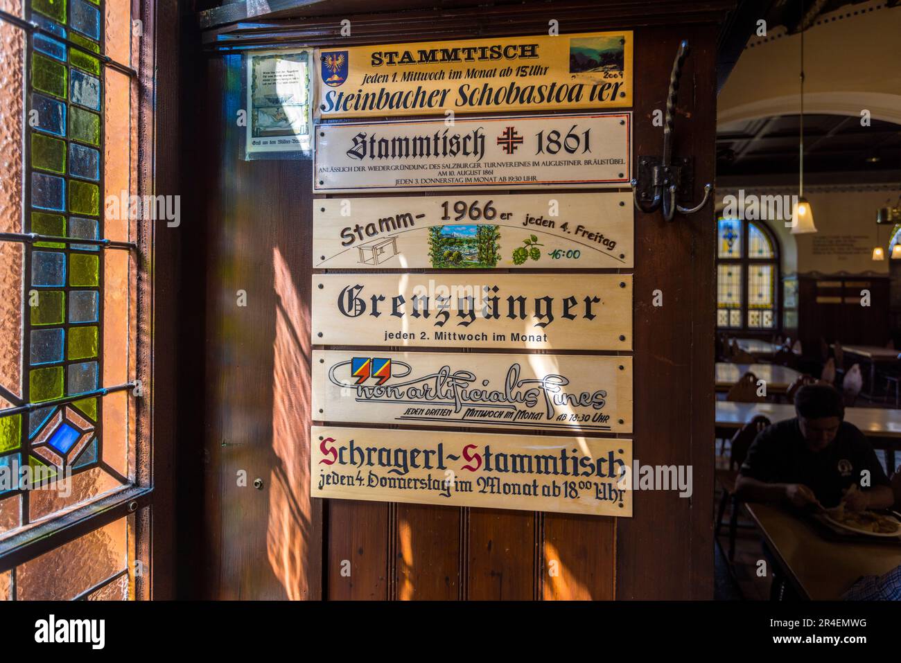 Stammtisch signs in the Stockhammer Hall of the Augustiner brewery, founded in 1621. The beer tavern is an institution for the people of Salzburg. A Stammtisch (cracker-barrel) consists of at least 8 people who meet once a month. Salzburg, Austria Stock Photo
