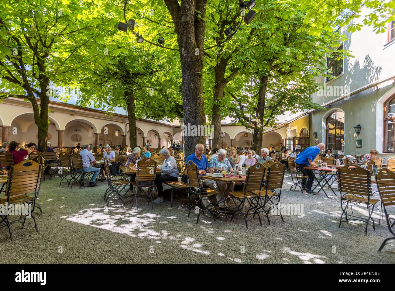 Beer garden of the traditional brewery Sternbräu in the old town of Salzburg, Austria Stock Photo
