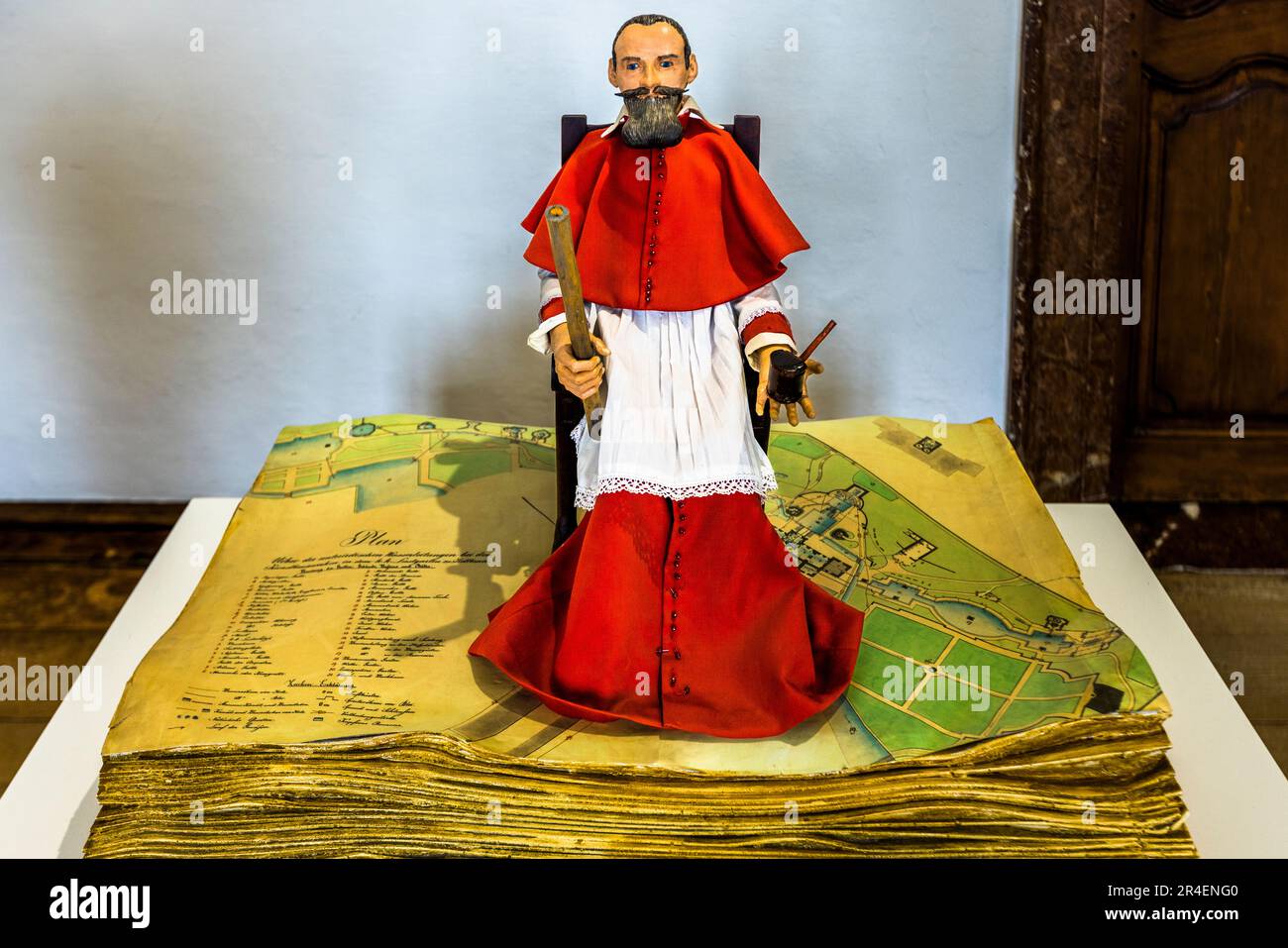 Figure of Prince and Archbishop Markus Sitticus on the plans of his pleasure palace in the museum of Hellbrunn Palace in Salzburg, Austria Stock Photo