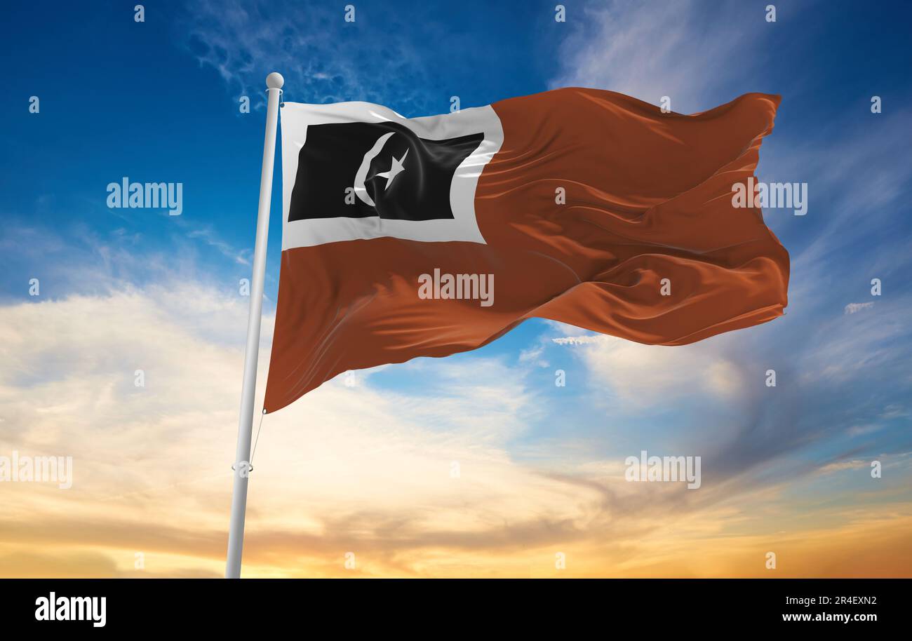official flag of Setiu, Terengganu Malaysia at cloudy sky background on sunset, panoramic view. Malaysian travel and patriot concept. copy space for w Stock Photo