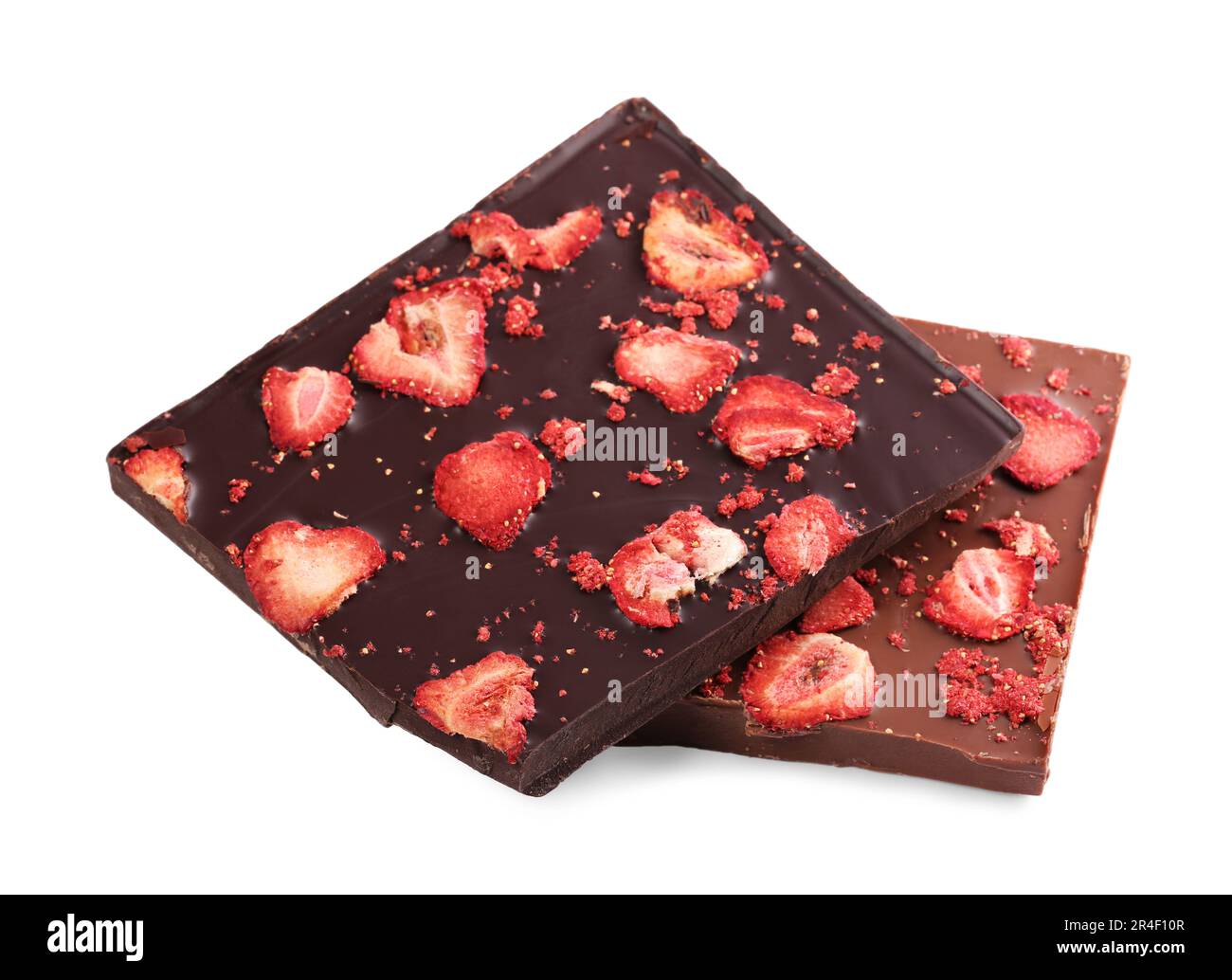 Halves of chocolate bars with freeze dried strawberries on white ...