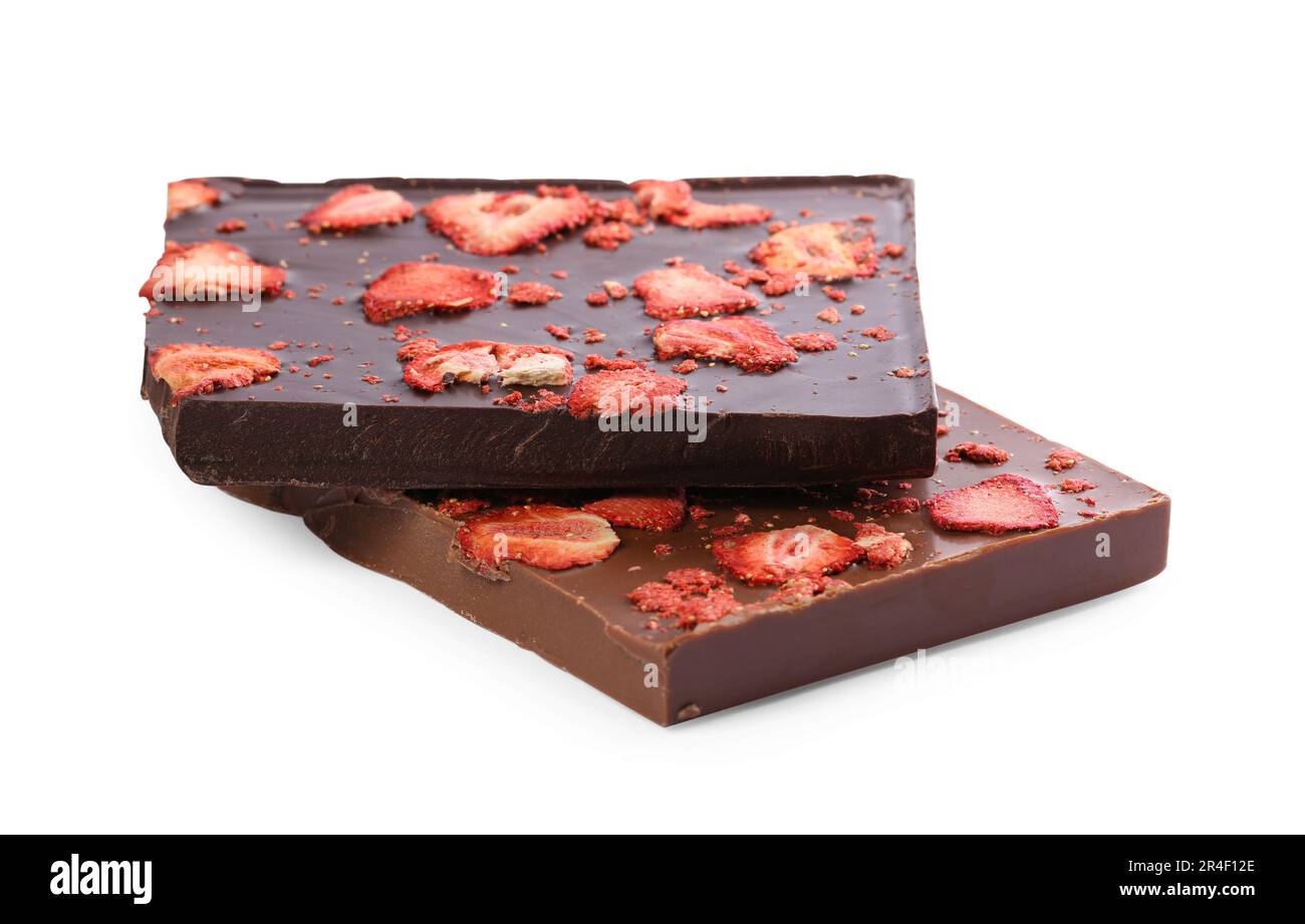 Halves of chocolate bars with freeze dried strawberries on white ...