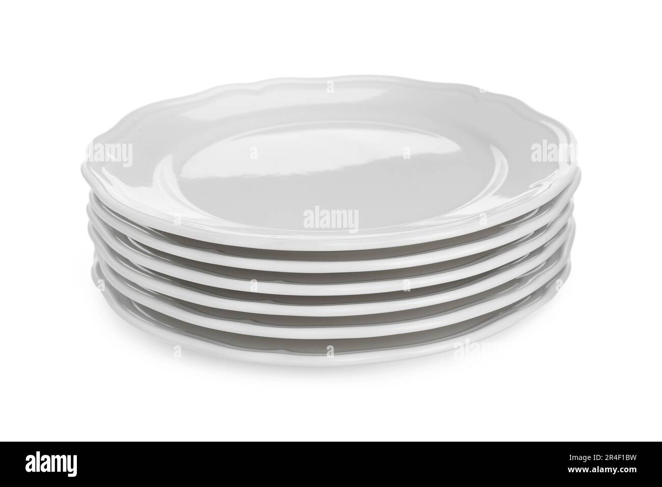 Stack of ceramic plates on white background Stock Photo - Alamy