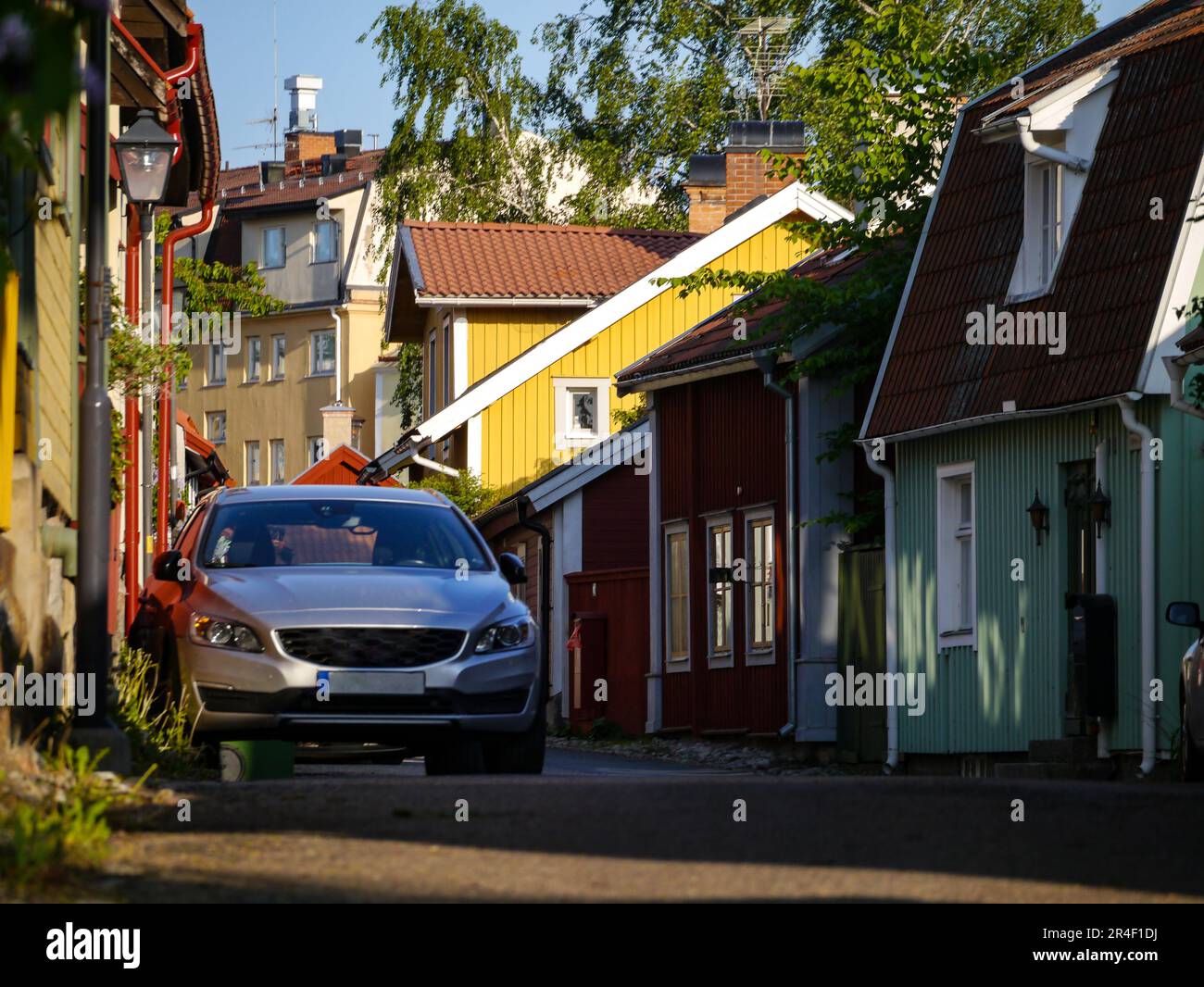 a car parked in front of a house Stock Photo - Alamy