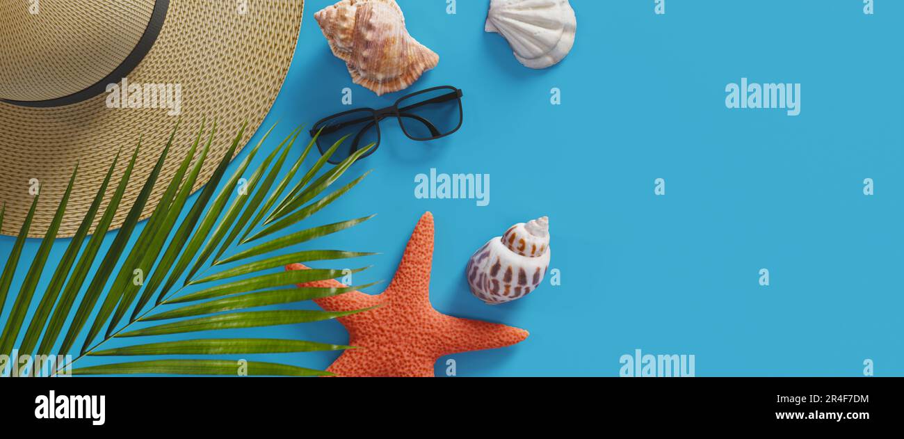 Summer vacation background with several seashells and a straw hat with ...