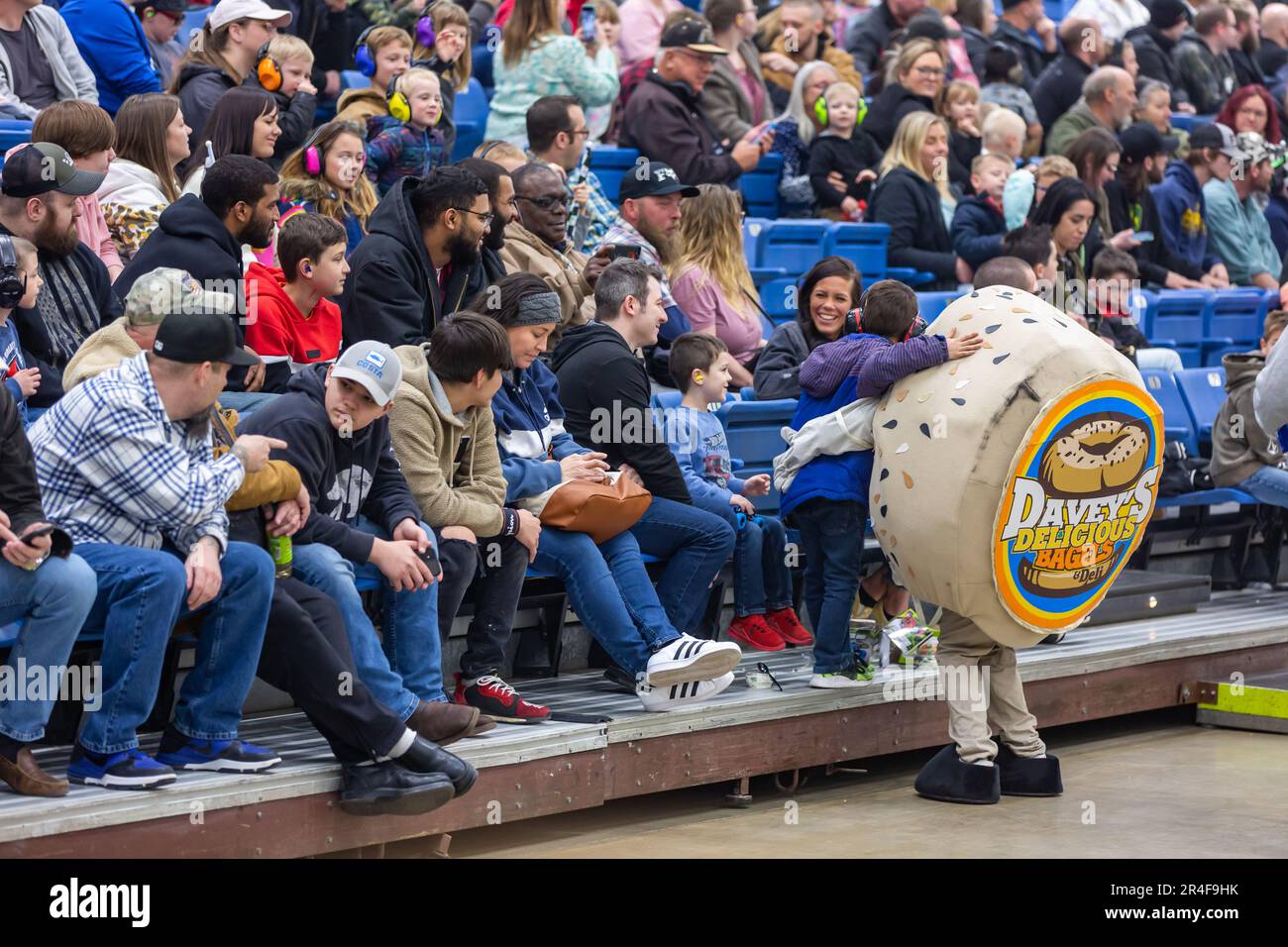 The Davey's Delicious Bagels mascot greets members of the crowd at the Allen County War Memorial