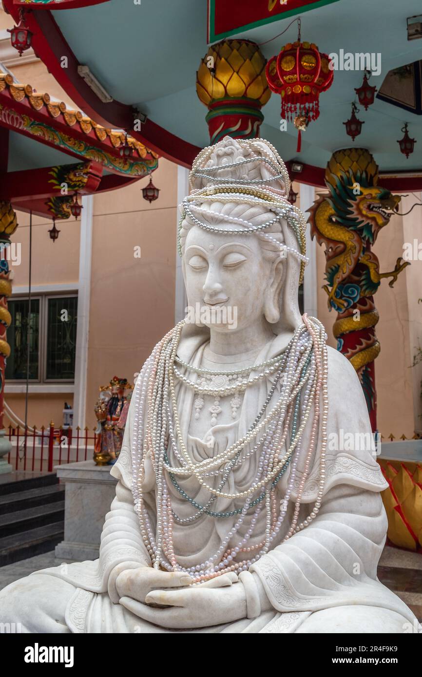Guanyin (Goddess of Mercy) shrine at Wat Intharawihan (Wat Intharavihan) - Thai Buddhist temple in Bangkok, Thailand Stock Photo